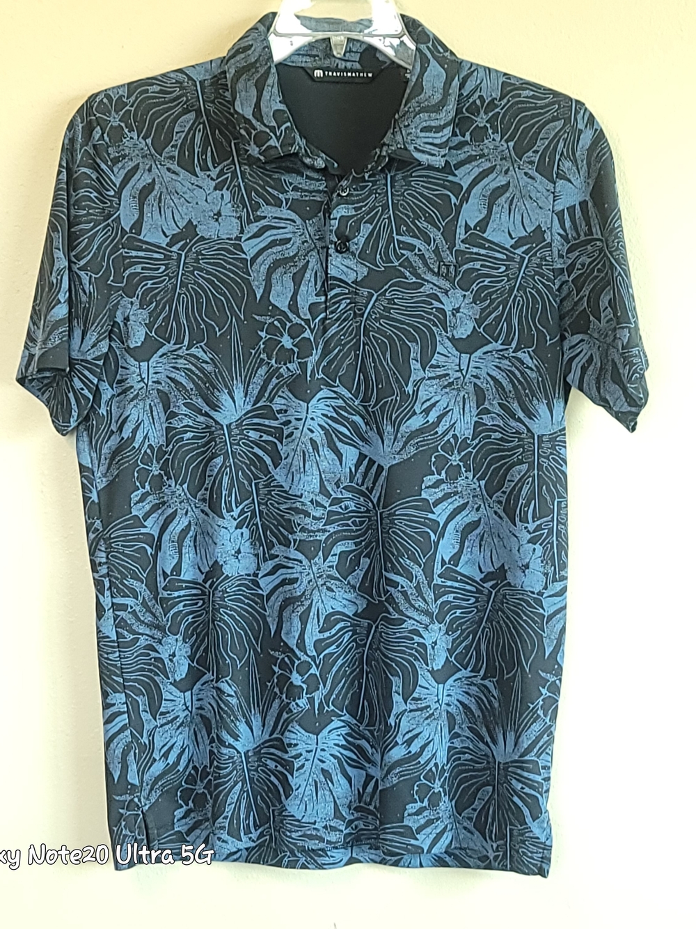 TravisMathew Men's Medium Polo Shirt Blue Black Tropical Floral Monstera Leaf